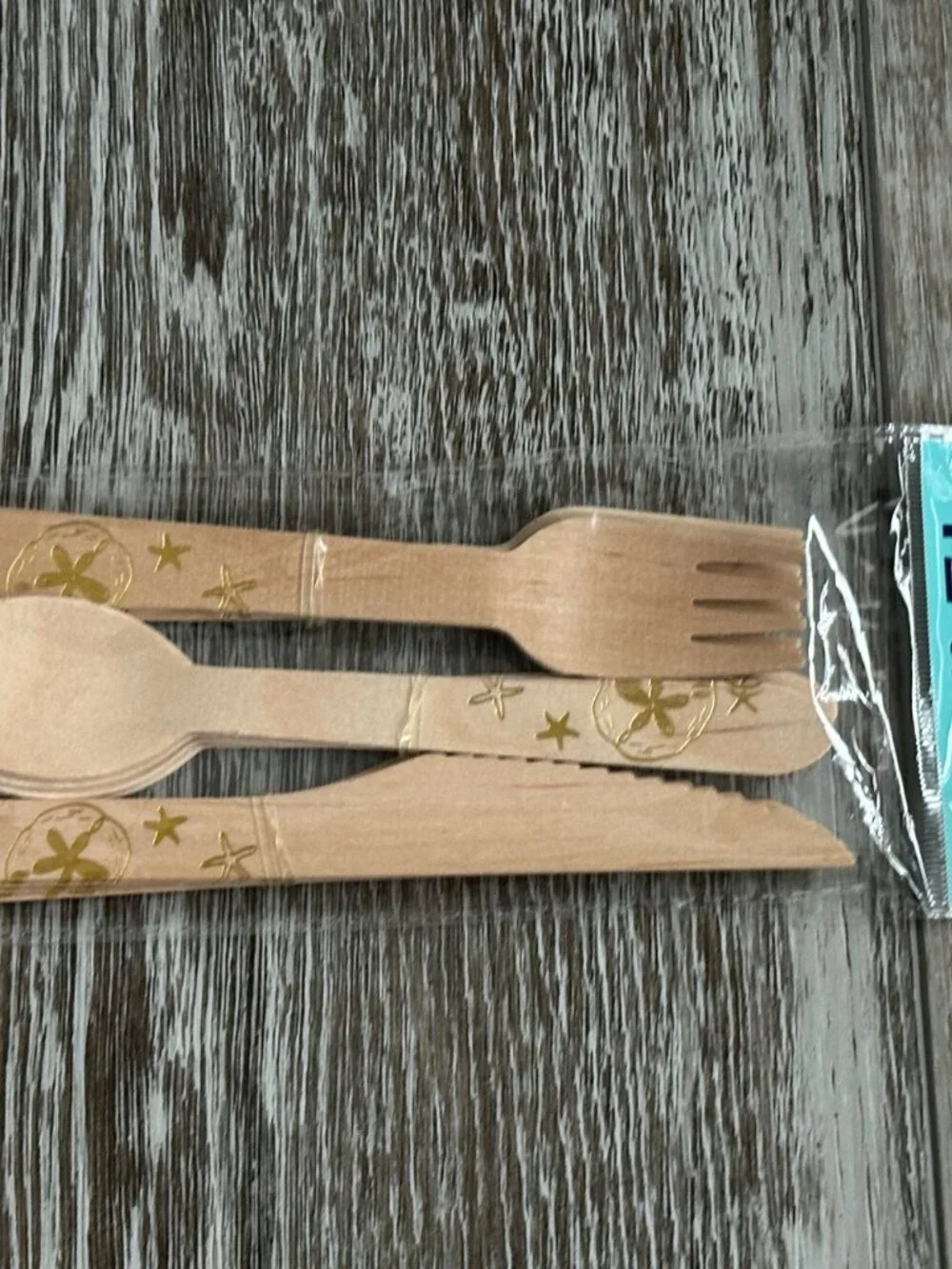 NWT Shore LIving 12 pc Cutlery Set Wood Silverware w Gold Starfish etc Design